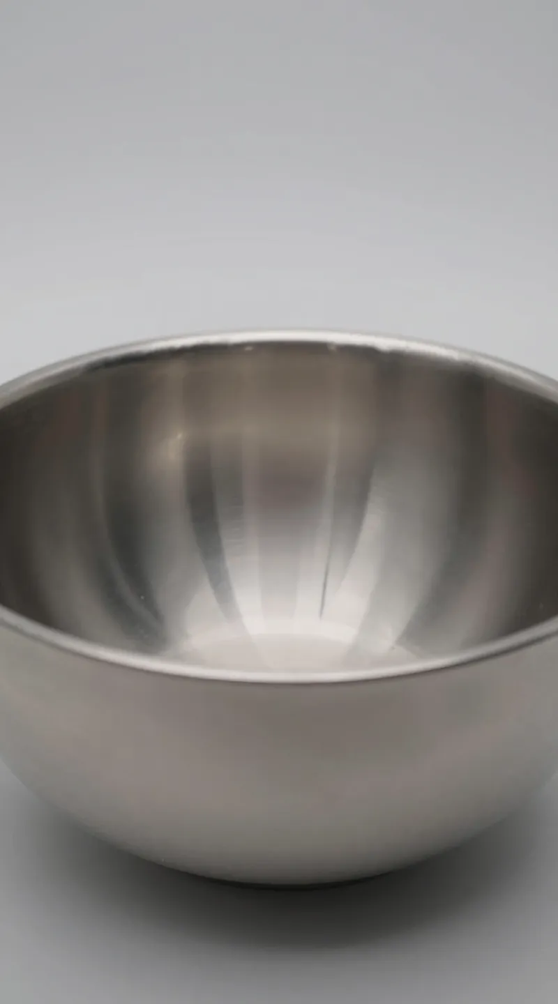 anti-jam feeder mechanism detail, stainless steel bowl, studio lighting